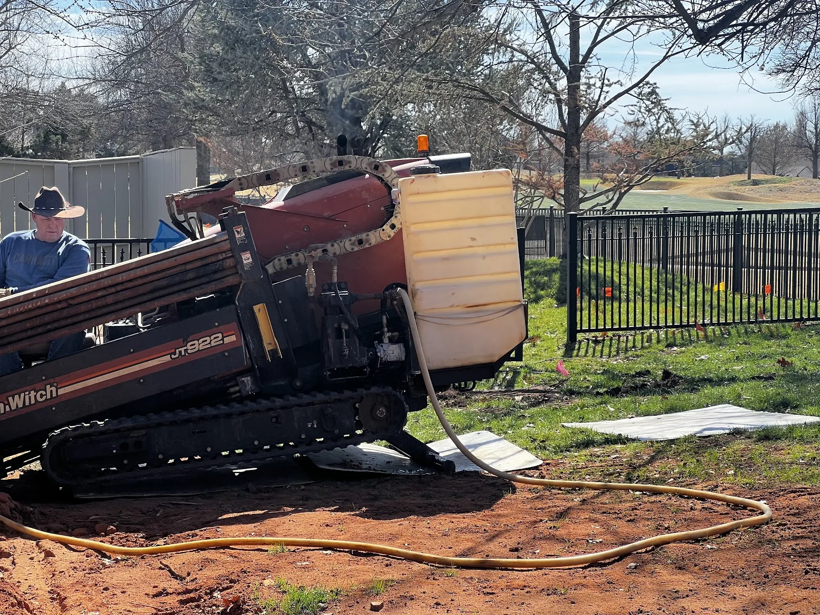 Texas HDD Contractors crew running hydrovac at a commercial parking lot directional bore in Dallas